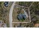 Stunning aerial view of mountain estate surrounded by lush green trees and mature landscaping at 60 Barton Ridge Dr, Breckenridge, CO 80424
