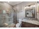 Modern bathroom features a glass-enclosed shower, sleek vanity with marble countertop, and stylish fixtures at 60 Barton Ridge Dr, Breckenridge, CO 80424