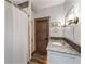 Well-lit bathroom featuring a shower with a herringbone tile accent and granite countertop at 60 Barton Ridge Dr, Breckenridge, CO 80424
