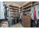 Walk-in closet with custom wood shelving, drawers, and hanging rods for organized storage solutions at 60 Barton Ridge Dr, Breckenridge, CO 80424