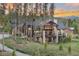 Secluded mountain home with expansive deck, stone accents, and floor to ceiling windows at 60 Barton Ridge Dr, Breckenridge, CO 80424