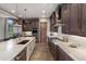 Modern kitchen featuring stainless appliances, granite counters, and custom wood cabinetry at 60 Barton Ridge Dr, Breckenridge, CO 80424
