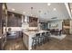 Spacious kitchen with a large island, stainless steel appliances, and hardwood floors offers a perfect space for entertaining at 60 Barton Ridge Dr, Breckenridge, CO 80424