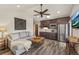 Open living room with vaulted ceilings, wet bar, comfortable sofa, and unique decor at 60 Barton Ridge Dr, Breckenridge, CO 80424