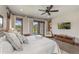 Main bedroom offering backyard views, a ceiling fan, and an ensuite bathroom at 60 Barton Ridge Dr, Breckenridge, CO 80424