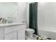 Bright bathroom featuring tiled shower and vanity at 24326 E Ohio Dr, Aurora, CO 80018