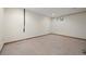 Unfinished basement space with tile flooring and a small window at 7346 S Platte Canyon Dr, Littleton, CO 80128