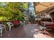 Spacious outdoor deck with seating, dining, and an awning at 7346 S Platte Canyon Dr, Littleton, CO 80128