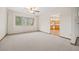 Open concept living room leading into the kitchen with hardwood floors and a bright window at 7346 S Platte Canyon Dr, Littleton, CO 80128