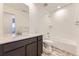 Modern bathroom with a shower-tub combination, stylish vanity, and elegant tile flooring at 8846 Waterleaf Ln, Littleton, CO 80125