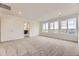 Bright bedroom features large windows and neutral carpeting at 8846 Waterleaf Ln, Littleton, CO 80125
