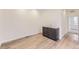 Living area features hardwood floors, sink, and doorway to bedroom at 8846 Waterleaf Ln, Littleton, CO 80125
