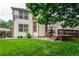 The backyard features a wooden deck and well-kept lawn, perfect for outdoor relaxation at 9614 W Powers Cir, Littleton, CO 80123
