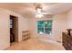 Bedroom with ceiling fan, carpet, and natural light at 9614 W Powers Cir, Littleton, CO 80123