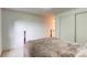 Neutral bedroom features a comfortable bed, and closet space at 9614 W Powers Cir, Littleton, CO 80123