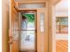 Welcoming entryway featuring a storm door and views to the outside at 9614 W Powers Cir, Littleton, CO 80123