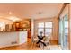 View of the kitchen and dining area, featuring natural light and an open floor plan at 9614 W Powers Cir, Littleton, CO 80123