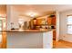 Traditional kitchen with wooden cabinets, stainless steel appliances, and granite countertops at 9614 W Powers Cir, Littleton, CO 80123