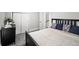 Charming bedroom featuring plush carpeting, a comfortable bed with decorative pillows, and ample closet space at 800 S Krameria St, Denver, CO 80224