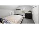 Cozy bedroom with a plush bed, carpeted floor, and traditional style furniture at 800 S Krameria St, Denver, CO 80224