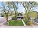 Charming two-story home with a well-manicured front yard and inviting porch at 800 S Krameria St, Denver, CO 80224