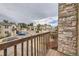 Balcony view shows a building with stone accents and an apartment complex parking lot at 6890 W Mississippi Ave # D, Lakewood, CO 80226