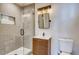 Updated bathroom with gray tile and glass shower at 2290 S Irving St, Denver, CO 80219