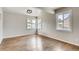 Bright dining room with hardwood floors and large windows at 2290 S Irving St, Denver, CO 80219