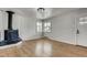 Living room featuring hardwood floors and a fireplace at 2290 S Irving St, Denver, CO 80219