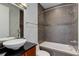 Modern bathroom with gray tile and updated vanity at 2460 W 29Th Ave # 303, Denver, CO 80211