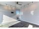 Second bedroom with large window and ceiling fan at 2460 W 29Th Ave # 303, Denver, CO 80211
