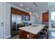 Modern kitchen with stainless steel appliances and an island at 2460 W 29Th Ave # 303, Denver, CO 80211