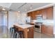Modern kitchen with island, stainless steel appliances, and light cabinets at 2460 W 29Th Ave # 303, Denver, CO 80211
