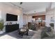 Open-concept living room flows into a modern kitchen with stainless steel appliances and stylish furnishings at 2460 W 29Th Ave # 303, Denver, CO 80211