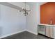 Modern wet bar with wine cooler and accent wall at 2460 W 29Th Ave # 303, Denver, CO 80211