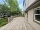 Spacious wooden deck overlooking the backyard and lush greenery at 124 High Country Trl, Lafayette, CO 80026