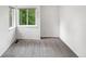 Bright bedroom with soft carpet and windows overlooking the trees at 124 High Country Trl, Lafayette, CO 80026