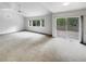 Open living room with access to the deck and plenty of natural light at 124 High Country Trl, Lafayette, CO 80026