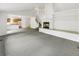Bright living room with a fireplace and access to the kitchen and staircase at 124 High Country Trl, Lafayette, CO 80026