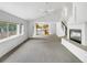 Spacious living room featuring a fireplace and large windows with deck access at 124 High Country Trl, Lafayette, CO 80026