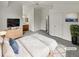 Tranquil staged bedroom with vaulted ceilings, ceiling fan, ensuite bathroom and soft lighting, ready to unwind at 124 High Country Trl, Lafayette, CO 80026