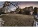 House from backyard with snow-covered lawn at 960 S Vance St, Lakewood, CO 80226