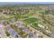Beautiful aerial view of a neighborhood featuring a park, walking trails, and well-maintained homes at 3314 Astorbrook Cir, Highlands Ranch, CO 80126