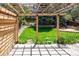 Backyard area with patio and pergola covered in lights, perfect for outdoor entertaining at 3314 Astorbrook Cir, Highlands Ranch, CO 80126