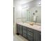 Bathroom featuring a dual sink vanity with storage and ample counterspace at 3314 Astorbrook Cir, Highlands Ranch, CO 80126
