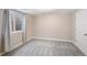Spacious bedroom with neutral colors, soft carpet, and a bright window providing natural light at 3314 Astorbrook Cir, Highlands Ranch, CO 80126