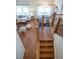 View from upstairs landing showcasing the hardwood floors and chandelier at 3314 Astorbrook Cir, Highlands Ranch, CO 80126