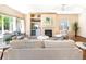 Cozy living room with fireplace, built-in shelving, and plenty of natural light at 3314 Astorbrook Cir, Highlands Ranch, CO 80126
