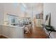 Bright, open-concept living area with high ceilings, hardwood floors, and abundant natural light at 3314 Astorbrook Cir, Highlands Ranch, CO 80126