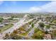 Aerial view of residential neighborhood near industrial area, with green tree coverage and intersecting roads at 690 W 1St Ave, Broomfield, CO 80020